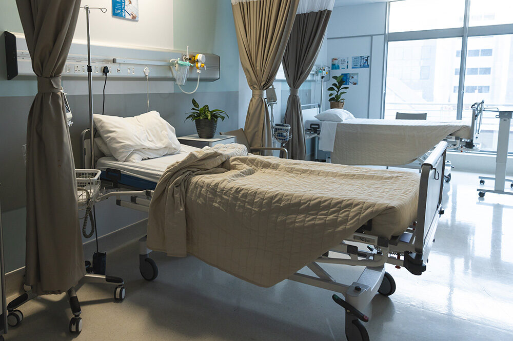 General view of patient room with beds.