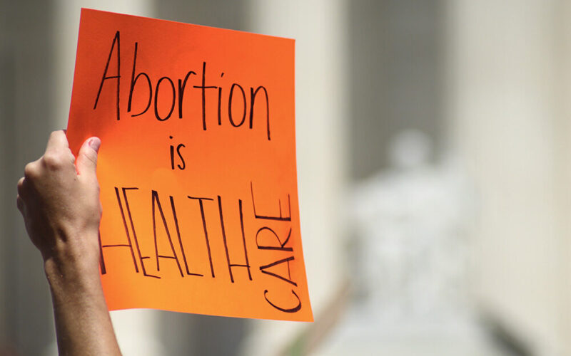 Hand Holding Sign Which Reads, "Abortion Is Health Care."