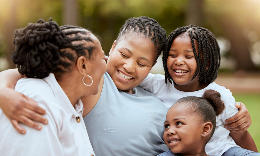 Black family bonding outdoor during summer